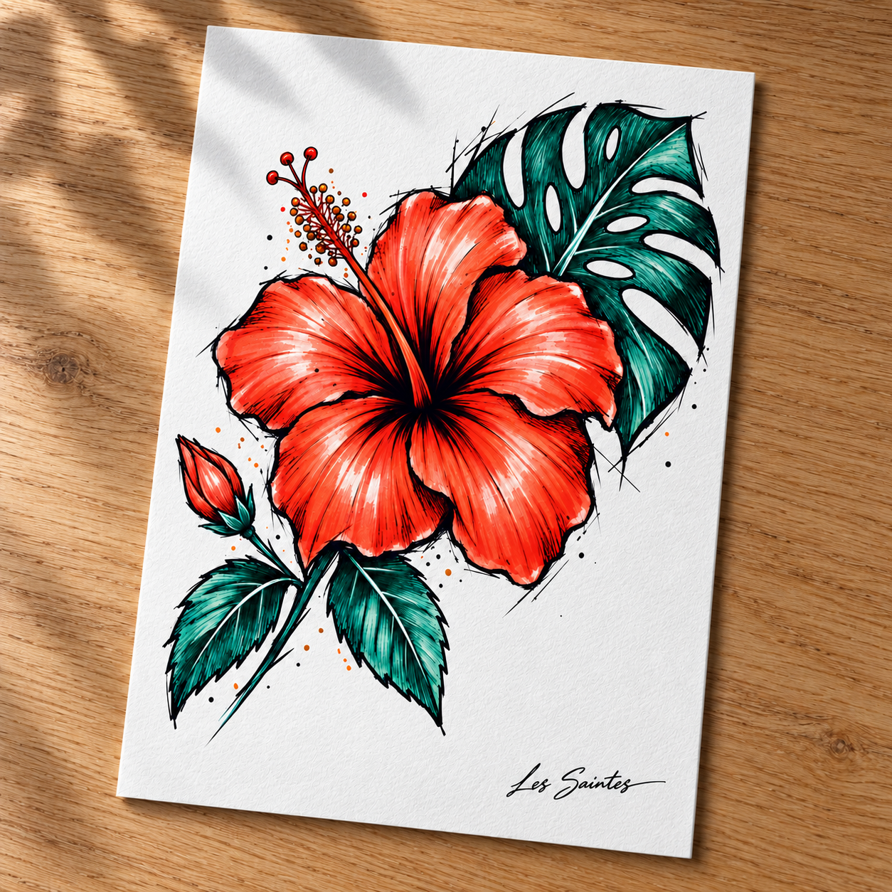 Carte postale — Hibiscus, papier texturé posé sur une table avec une légère ombre de feuillage — Atelier Karaïbes, Les Saintes